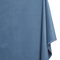Close-up of a blue textured fabric on a white background
