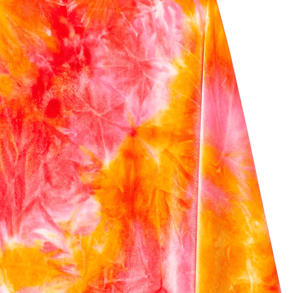 Close-up of a tie-dye fabric with orange and pink patterns on a white background | Beautiful Windows Elgin