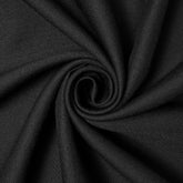 Close-up of black fabric with visible stitching and texture.
