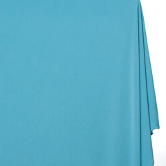 Turquoise fabric draped over a white background |Sold by beautifulwindowselgin.com