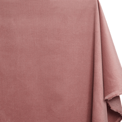 Close-up of pink fabric with a textured pattern