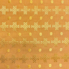 Patterned fabric with gold crosses and dots on a brown background