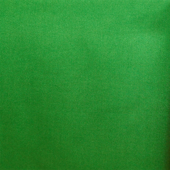 A close-up image of kelly green crepe back satin fabric showing its texture and sheen.