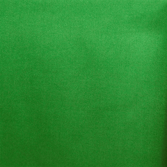 A close-up image of kelly green crepe back satin fabric showing its texture and sheen.