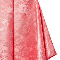 Pink fabric with floral pattern on a white background
