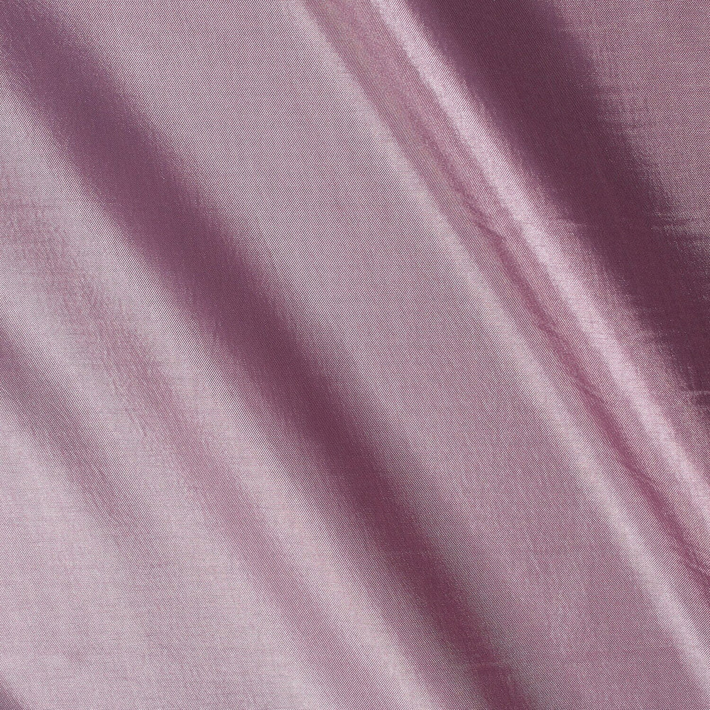 Close-up of purple fabric with visible texture and folds