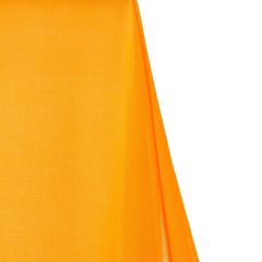 Close-up of bright orange fabric on a white background