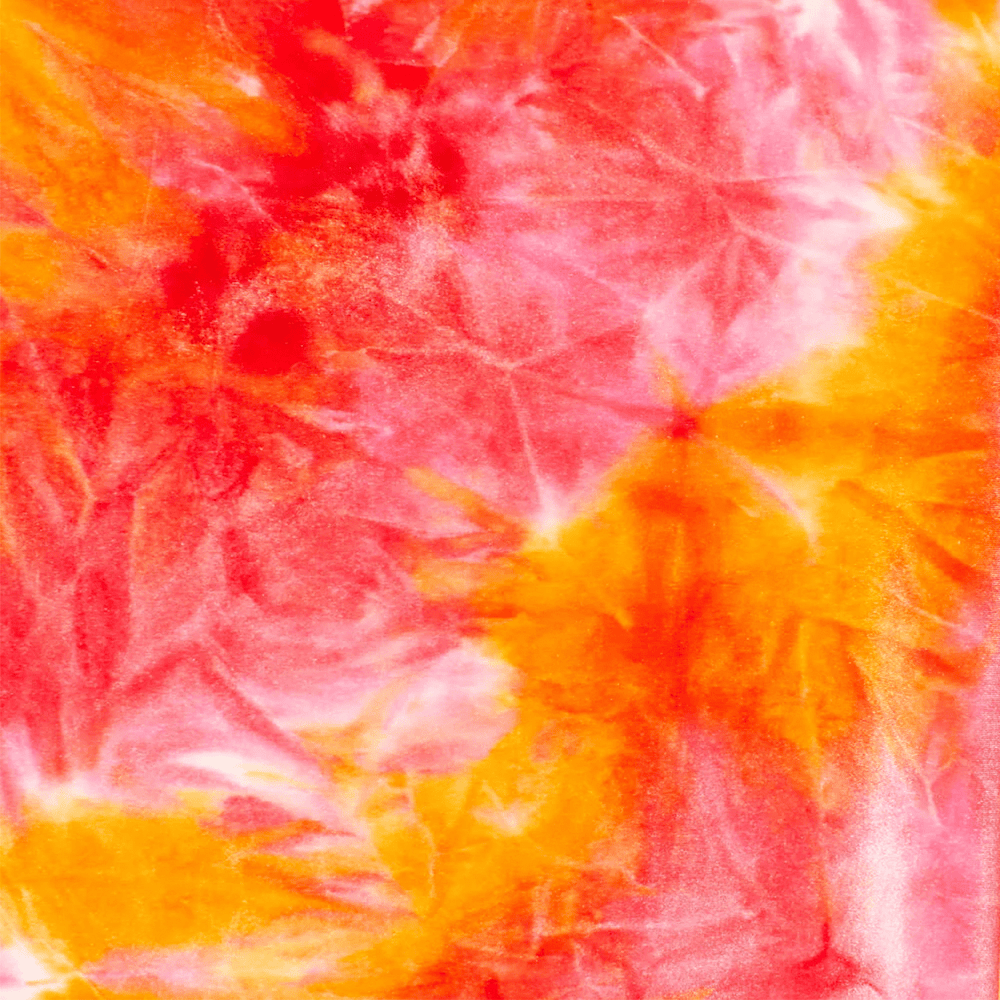 Close-up of tie-dye fabric with pink, orange, and white colors.