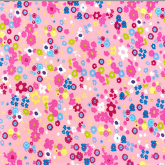 A woven textile fabric featuring a pink background with a scattered pattern of small multicolored flowers and circles.