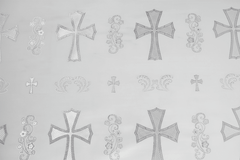 Pattern of decorative crosses and floral elements on a light gray background | Sold by Beautiful Windows Elgin
