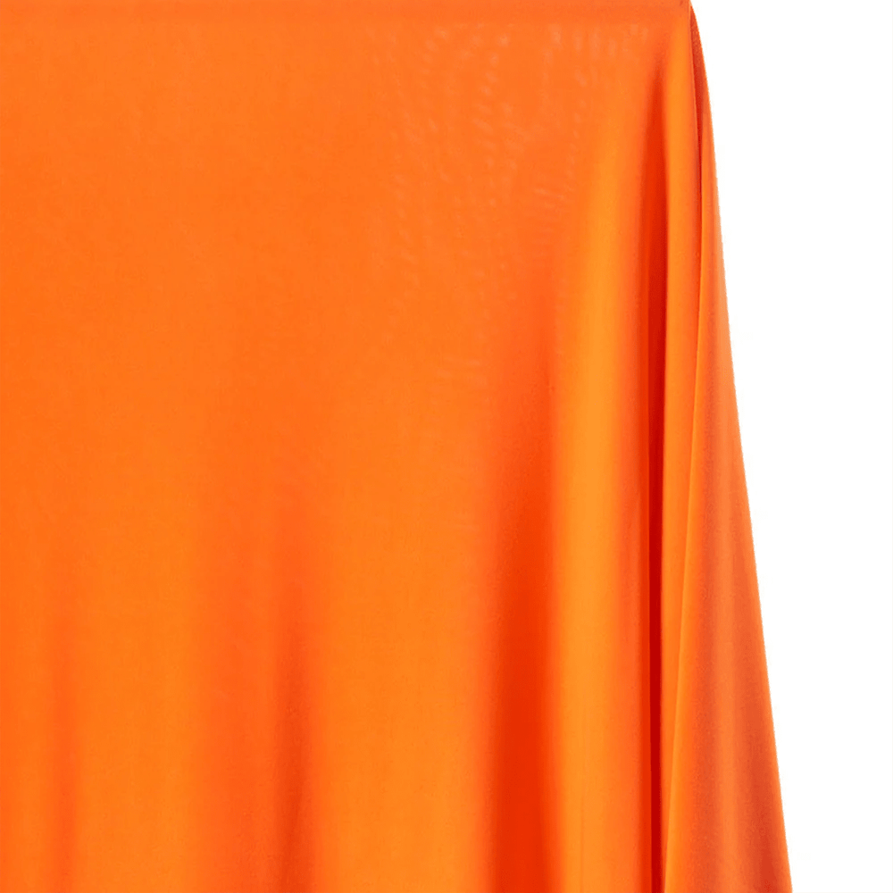 Close-up of bright orange fabric with a white background | sold by BeautifulWindowsElgin.com