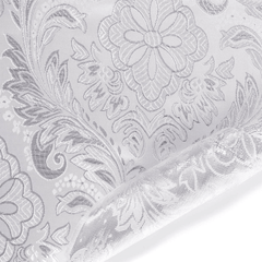 Close-up of embossed floral and leaf pattern on a textured surface