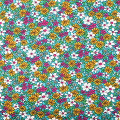 Fabric featuring a multicolored daisy print on a turquoise background| Sold by the Beautiful Windows Elgin