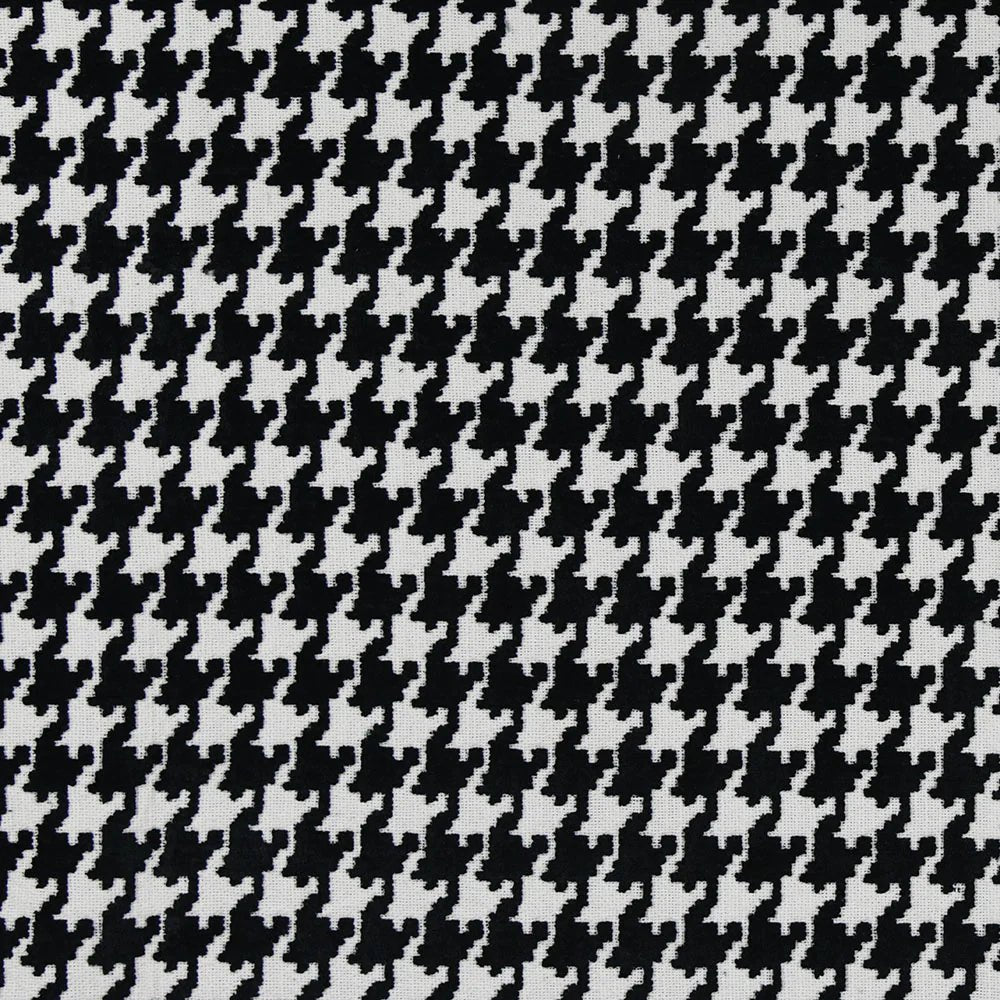 A close-up view of a black and beige houndstooth pattern fabric| Sold by Beautiful Windows Elgin