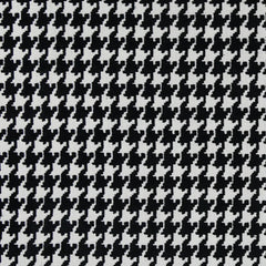 A close-up view of a black and beige houndstooth pattern fabric| Sold by Beautiful Windows Elgin