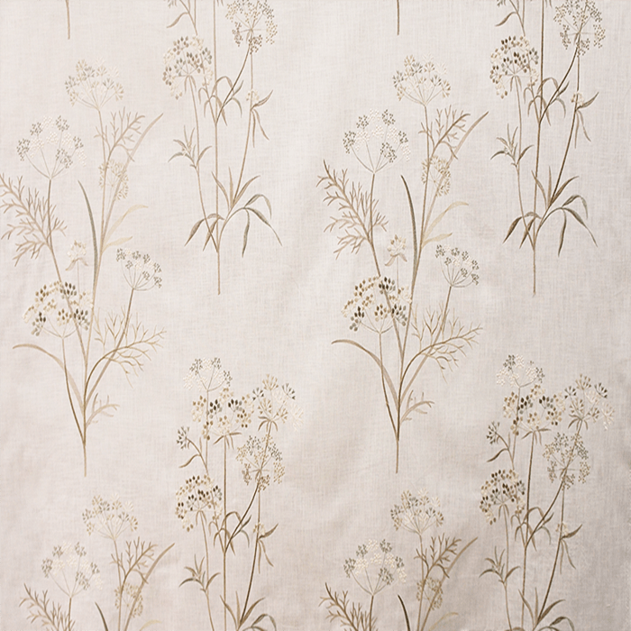 A beige fabric with a floral embroidery pattern| Sold by Beautiful Windows Elgin