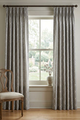 Gray fabric with white embroidered diamond pattern
