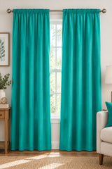 A close-up of a solid teal fabric texture with a soft, slightly mottled surface.