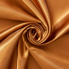 Luster Copper—Charmeuse Satin—Lustrous Finish on Front—100% Polyester—Width (58/59 Inches)—Available by the Yard