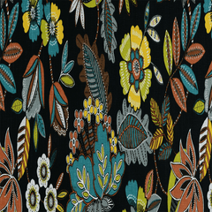 A woven black cotton fabric with a vibrant floral pattern in red, blue, and green colors.