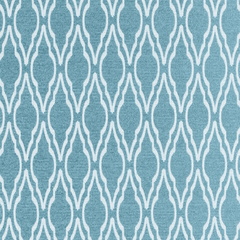 Close-up view of a geometric patterned upholstery fabric in shades of green and blue| Sold by the Yard