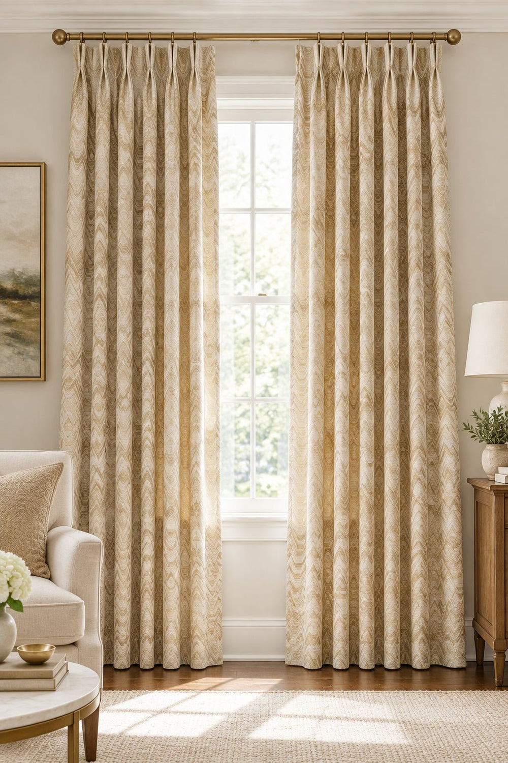 A close-up of a woven fabric with a repeating chevron pattern in beige, cream, tan, and light brown tones.