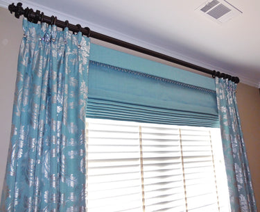Blue patterned curtains with a roman shade| Beautiful Windows Elgin