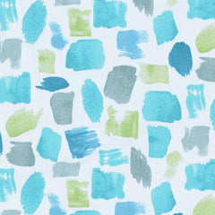 A textile fabric with a dotted pattern featuring various shades of blue and white colors.