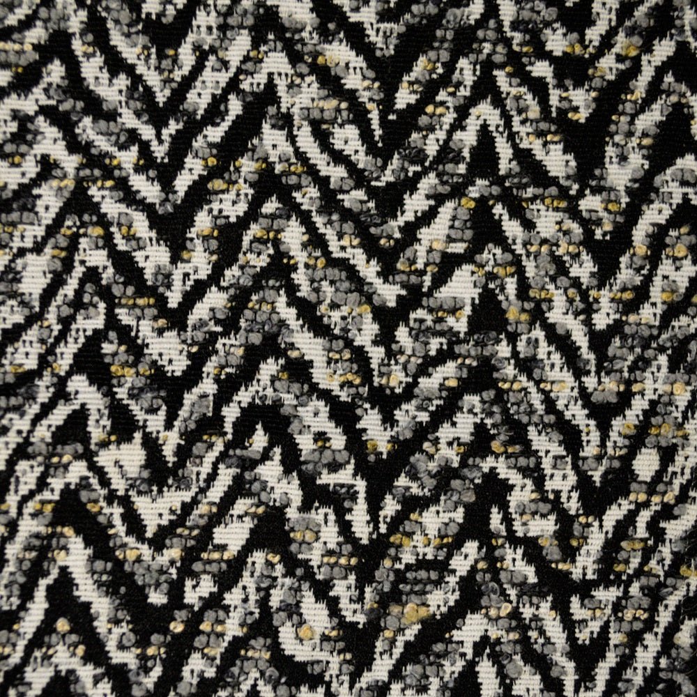 Geometric pattern with black and green lines on a white background.