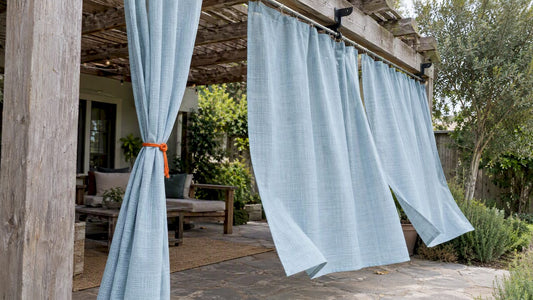Outdoor curtains moving gently in a breeze