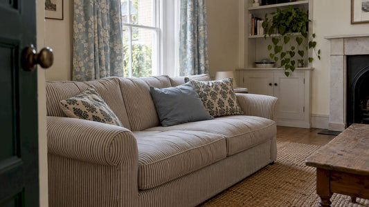 Living room combining floral, striped, and block-print patterns
