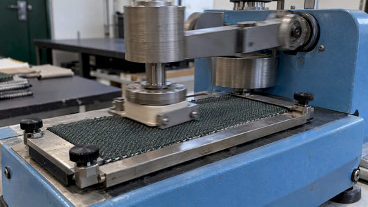 Fabric undergoing a Wyzenbeek abrasion test