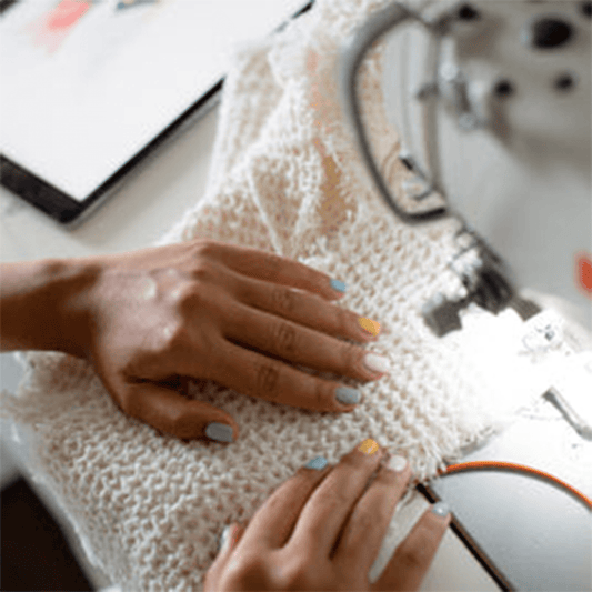 “Beginner sewing machine on a clean workspace with fabric and tools.”