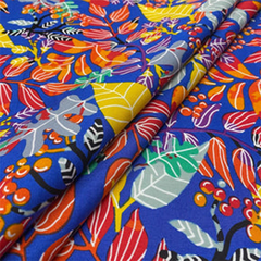 The fabric consists of blue printed roses with colored stems— Beautiful Windows Elgin