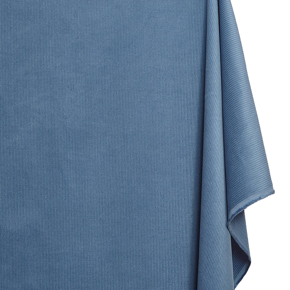 Close-up of a blue textured fabric on a white background