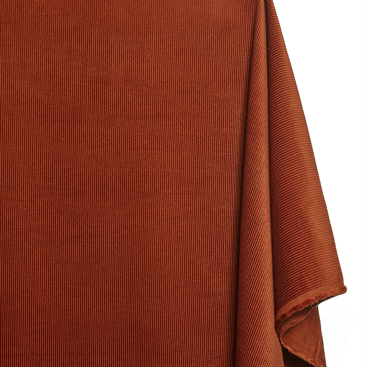 Close-up of brown fabric with a textured pattern on a white background