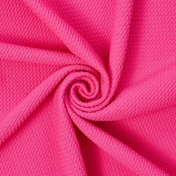 Bold texture—Apparel fabric—Fuchsia color—Composition: 100% polyester—58" inches wide—Available by yard.
