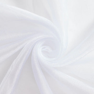 Lenny Crystal—White Organza Fabric—Composition: 55% Nylon, 45% Polyester—Sold by the Yard—Width: 60/61 Inches.