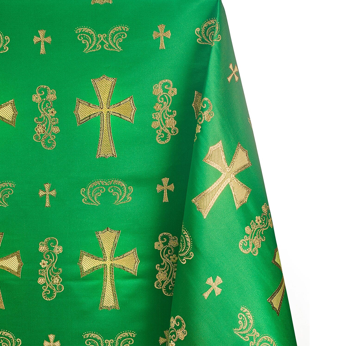 Green fabric with gold embroidered crosses and patterns
