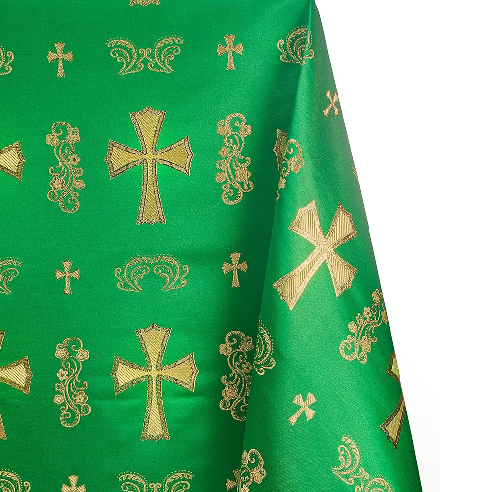 Green fabric with gold embroidered crosses and patterns