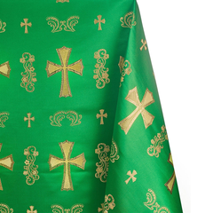 Green fabric with gold embroidered crosses and patterns