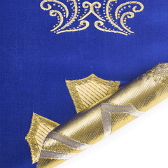 Close-up of blue fabric with gold embroidery
