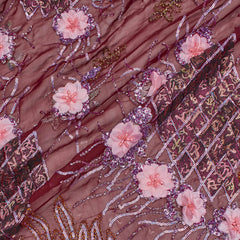 Close-up of burgundy floral beaded georgette lace fabric with sequins.