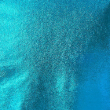 TURQUOISE STRETCH FOIL LAME ON INTERLOCK KNIT MATERIAL