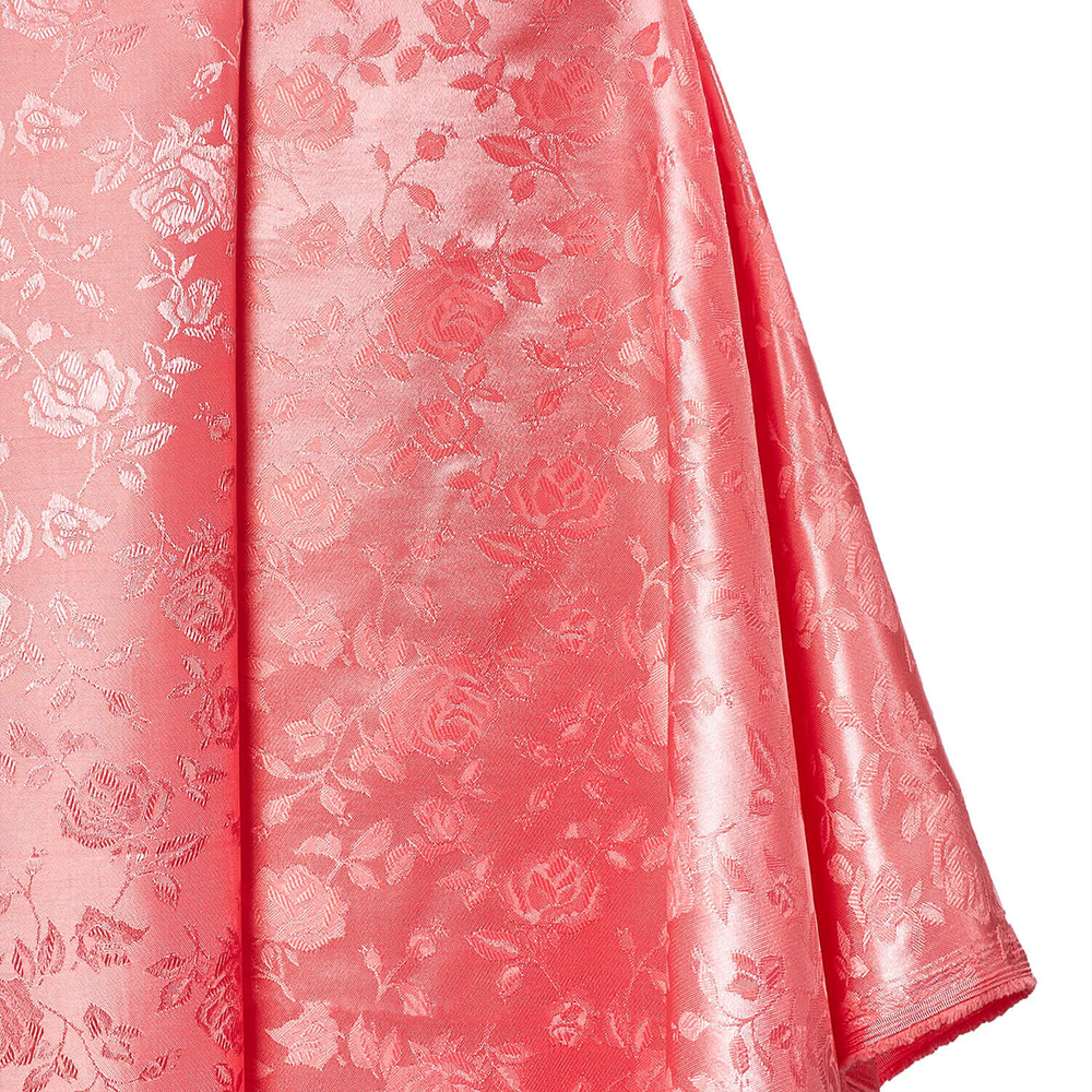 Pink fabric with floral pattern on a white background