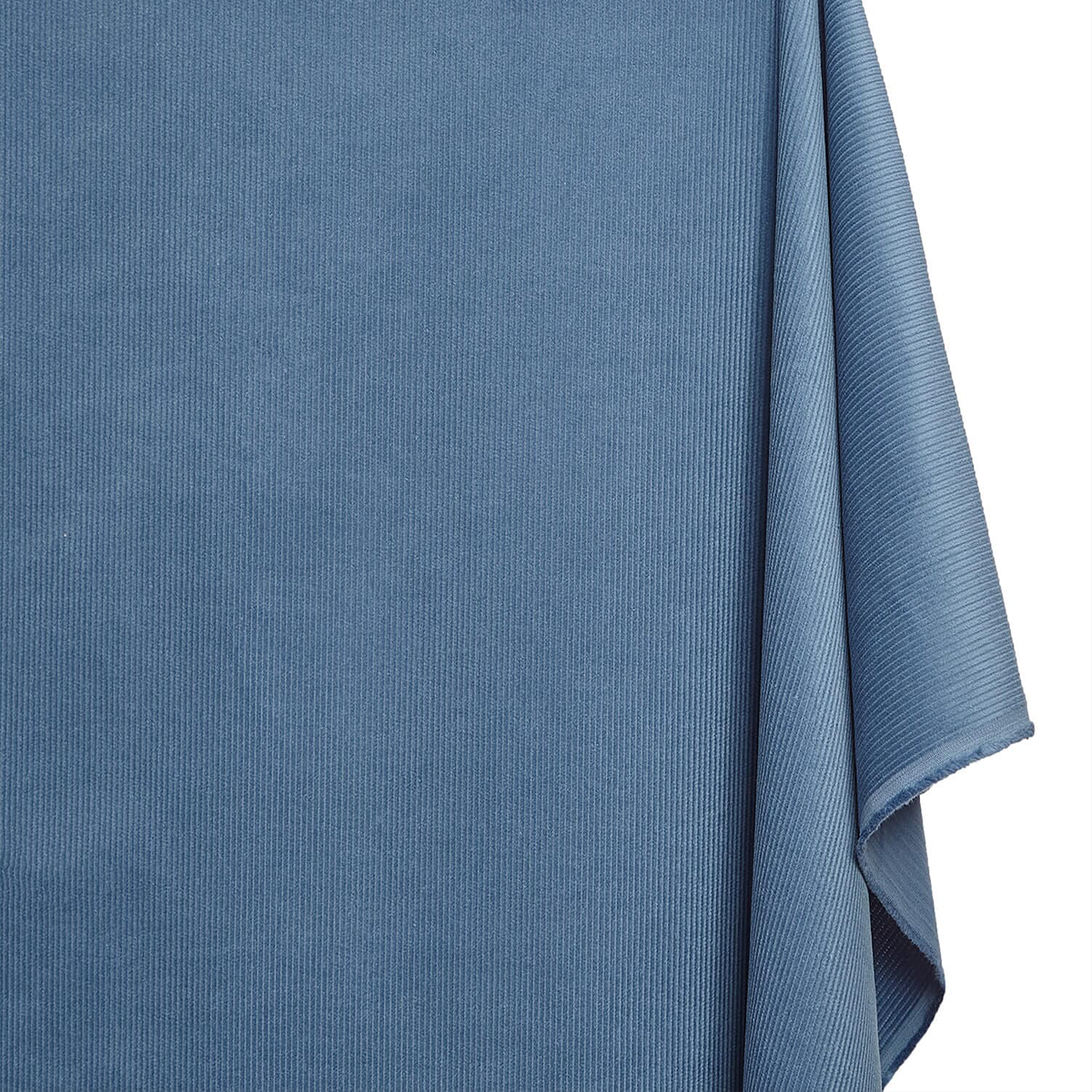Close-up of a blue textured fabric on a white background