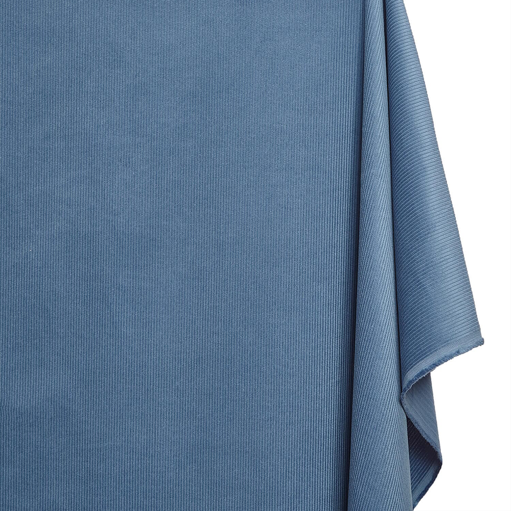Close-up of a blue textured fabric on a white background