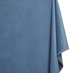 Close-up of a blue textured fabric on a white background