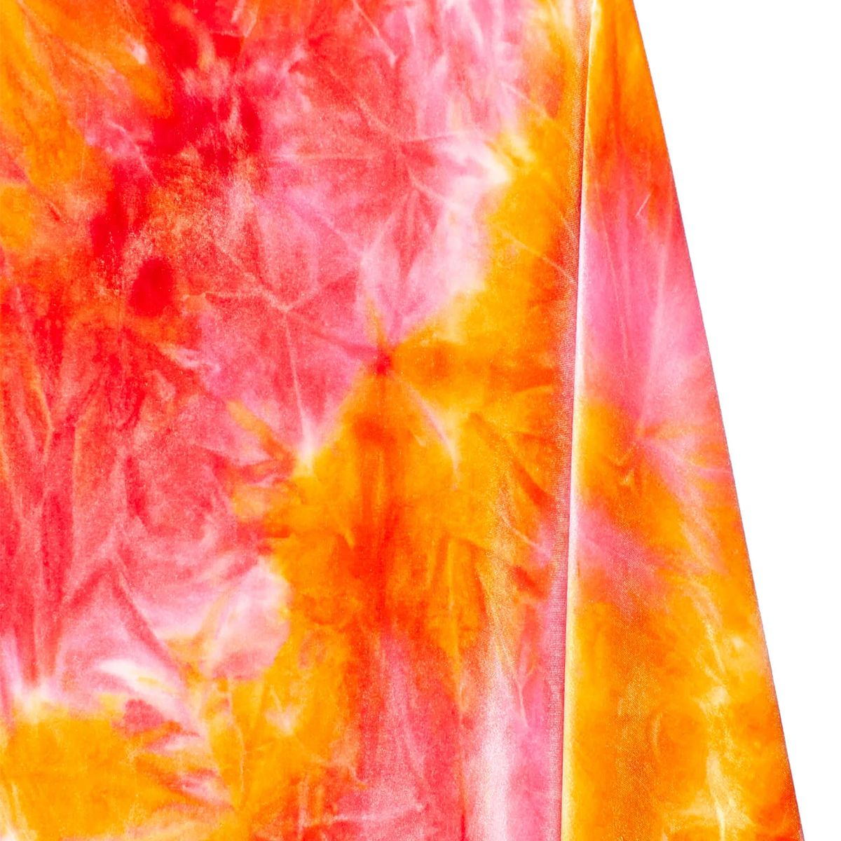 Close-up of a tie-dye fabric with orange and pink patterns on a white background