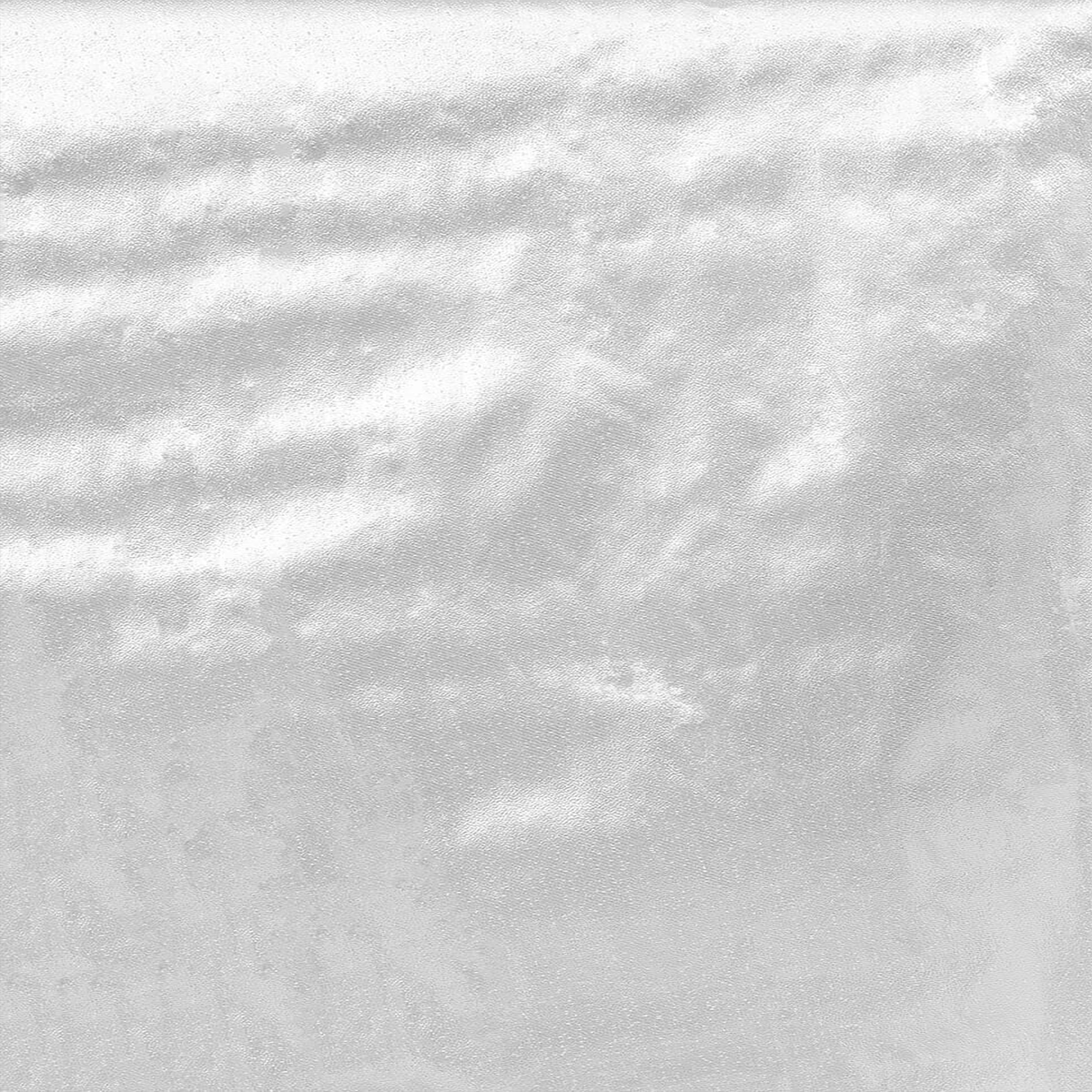 A close-up image of a silver tissue lame material with a subtle embossed pattern and metallic sheen.